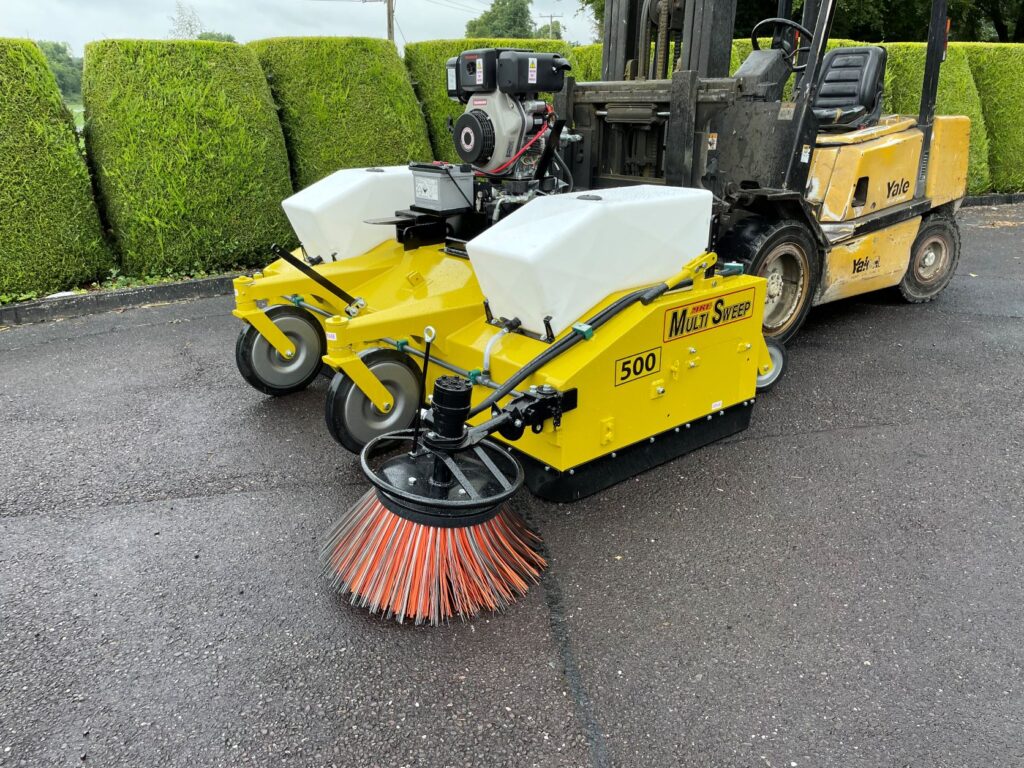 Multi Sweep 500 with twin water tanks and a side kerb brush on a forklift