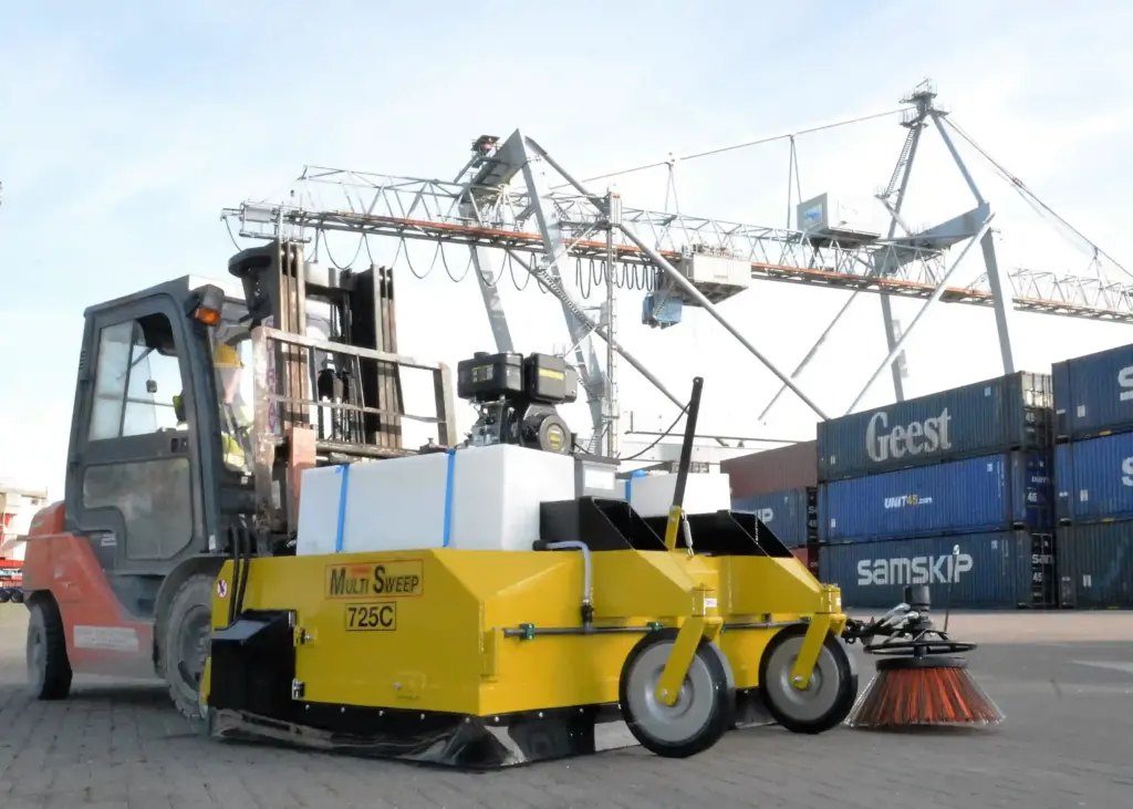 Multi Sweep 725C with power pack, water tank and kerb brush on a forklift at a container port