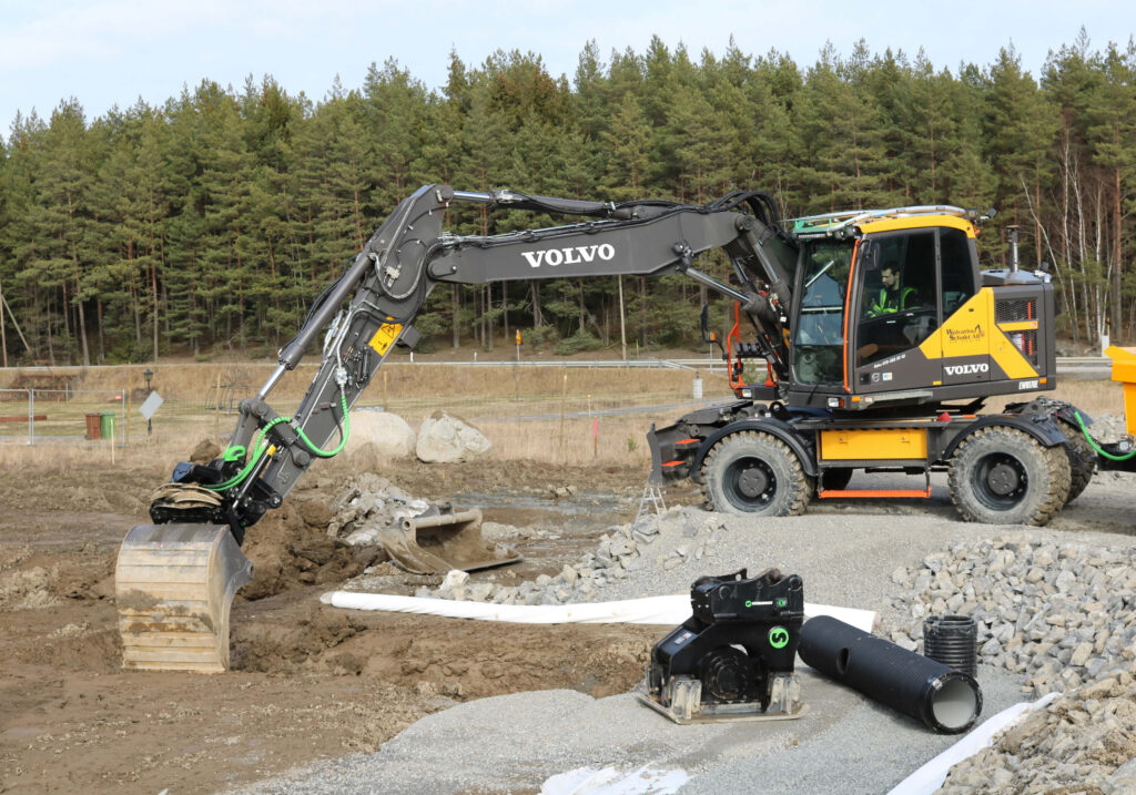 Volvo wheeled excavator fitted with a Steelwrist tiltrotator and bucket, with an SQ compactor tool in front