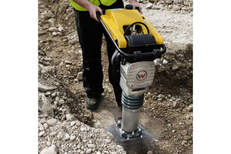 Wacker Neuson BS50-2 two-stroke rammer compacting soil in a trench