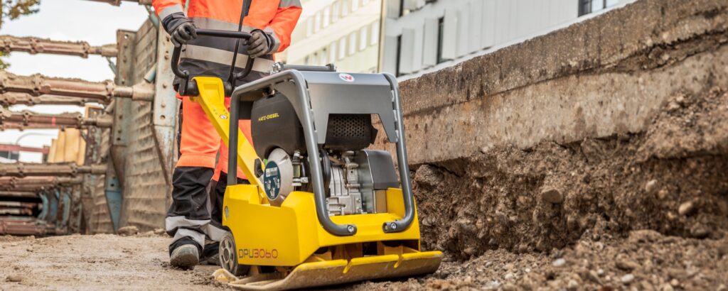 Wacker Neuson DPU3060 diesel reversible plate compacting in a shored trench